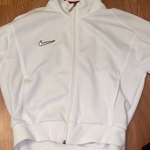 A Nike at the waist zip up